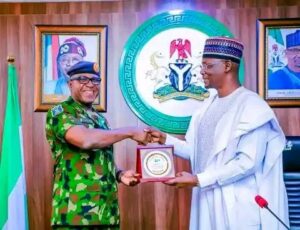 Gov. Sule in handshake with Air Marshal Abubakar