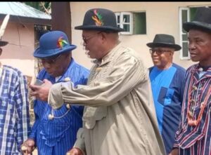 Former President Olusegun Obasanjo in blue hat discussing with his host and celebrant, Professor Vincent.O.Nmehielle at his 60th Birthday ceremony in Rumuada-Ogbakiri, Emohua Local Government Area of Rivers State