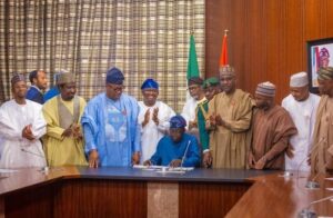 President Bola Tinubu signing the budget