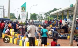 File: People struggling to buy fuel