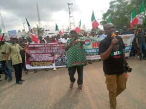 Edo NLC chairman, Odion Olaye (with microphone) leading the protest