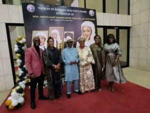 Justice Mary Odili, third right, her husband, Dr Peter Odili, third left and their children