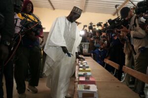 Opposition Candidate, Bassiro Faye, casts his votes today at Ndieganiao in Mbour Polling Station