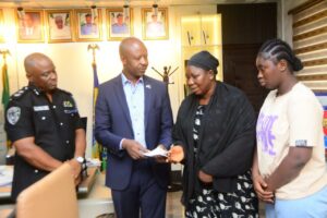 Wife of the Late Inspector Monday Issah receiving the cheque of N20M from Dr Tammy Danagogo, Secretary to the Rivers State Government, on behalf of Governor Fubara at Police headquarters Moscow Road Port Harcourt on Monday, March 11