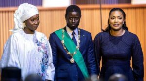President Faye, with his two wives, Marie, left and Absa, righ, just after being sworn in today