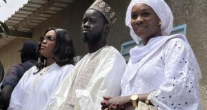 President-Elect, Bassirou Diomaye Faye, sandwiched by the two incoming First Ladies, Marie Faye, left, Absa Faye, right