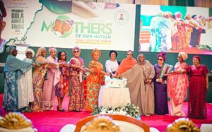 Pix 1: L-R Former Minister, Chief Mrs Nike Akande, wife of former president, Mrs Bola Obasanjo, Former First Lady, Dame Patience Jonathan, Former First Lady, Mrs Victoria Gowon, the First Lady of the Federal republic of Nigeria Senator Oluremi Tinubu, wife of the Vice President Hajia Nana Shettima and wife of the Senate President Mrs Ekaette Akpabio cutting the cake at an event tagged Celebrating the Mothers of our nation in commemoration of the First Anniversary of the Administration of President Bola Ahmed Tinubu held in Abuja on Saturday 25th May