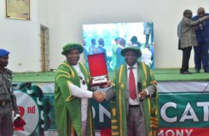 Governor Hope Uzodimma of Imo State (left), receives sovernir from the Vice Chancellor of the University of Nigeria, Nsukka, Prof. Charles Igwe, after delivering the 52nd Convocation Lecture at the Princess Alexandra Auditorium, UNN, on Thursday