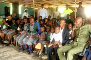 Abraham Olorunnimilo and students of the school