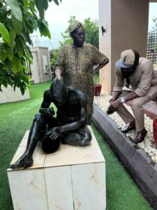 Omooba Shyllon and one of his artwork collections
