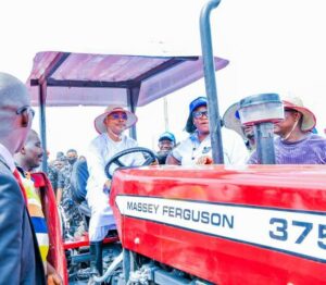 Governor Ododo with one of the tractors for Kogi farmers