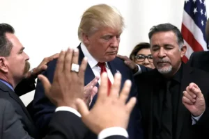 Former U.S. president Donald Trump prays with pastors during a campaign visit to the International Church of Las Vegas and the International Christian Academy in Las Vegas, Nevada, U.S., October 5, 2016. REUTERS/Mike Segar TPX IMAGES OF THE DAY