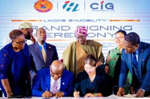 Governor of Lagos State, Mr. Babajide Sanwo-Olu (middle, back row) flanked by his Deputy Dr. Obafemi Hamzat (left); Consul General of Peoples Republic of China, Ms. Yan Yuqing (right), watch as the GMD/CEO of IBILE Holdings, Mr. Tobi Lawal and Chairman of CIG Group, Chief Diana Chen sign new Lagride partnership with CIG Motors, at the Lagos House, Ikeja, on Monday, 15 July 2024.