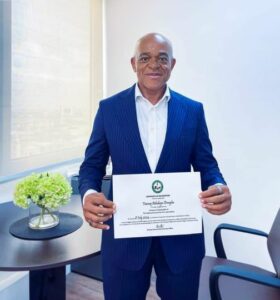 Oreagba displaying his certificate