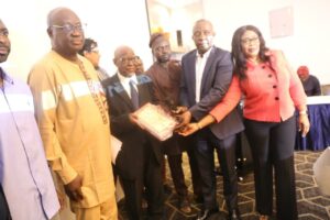 Presentation of plaque to Prof. olatunji Dare's family.jpg