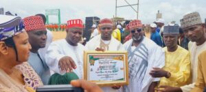 Bature flanked by Kano Government officials.jpg