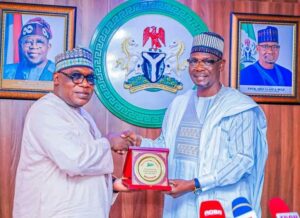 Gov. Sule and Engr. Nkom in handshake.jpg