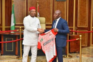 Governor Hope Uzodimma of Imo State (left) unveils Mr. Emmanuel Amuneke as the new Technical Manager of Heartland Football Club of Owerri...Monday.jpg
