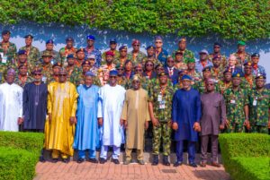 President Tinubu in a group photograph with Course 32 participants of the National Defence College.jpg