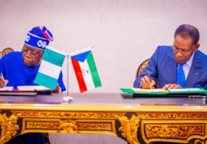 Presidents Bola Tinubu and Teodoro Obiang Nguema Mbasogo signing the agreement.jpg