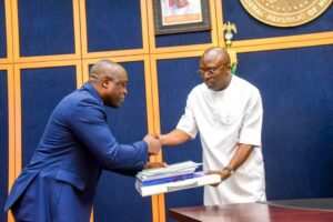 Rivers State Governor, Sir Siminalayi Fubara (right); receiving copies of the report of the State Economic and Investment Summit 2024 from the Chairman, Central Organising Committee, Mr Chibeoso Aholu (left); during the presentation of the report at the Government House in Port Harcourt on Thursday