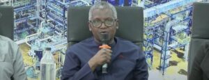 Aliko Dangote with a bottle of petrol at the ceremony.jpg