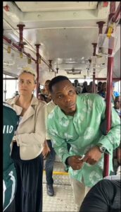 Chief Minister Sengeh and his wife standing inside the bus.jpg