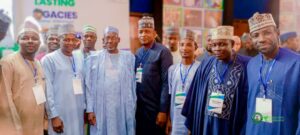 Governor Namadi in a group photograph with participants during the event.jpg