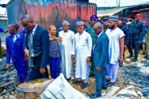 Governor Ododo when he visited the burnt GSM Village.jpg