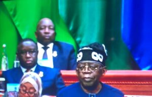 President Tinubu delivering his speech, with Presidents Bio and Ramaphosa listening with rapt attention.jpg