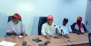 Crusoe Osagie (middle) and others