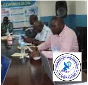 Commissioners at IMC reading out the revocation notice today in Freetown.jpg