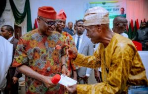 Governor Biodun Oyebanji and one of the pensioners.jpg