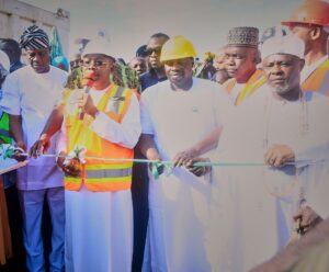 Governor Ododo cutting the flag-off tape.jpg