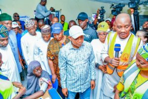Governor Ododo with persons and families displaced by the flood.jpg
