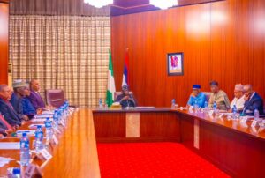 President Tinubu and others at the meeting.jpg