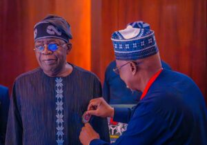 President Tinubu being decorated.