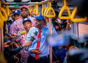 From left, Governor of Lagos State, Mr. Babajide Sanwo-Olu onboard the train on the Redline fielding questions from the Press during the flag off of commercial operations of the Redline rail at the Oyingbo Terminal on Tuesday, 15 October 2024. Behind him are Managing Director of LAMATA, Engr. (Mrs) Abimbola Akinajo and Commissioner for Transportation, Mr. Oliwaseun Osiyemi.