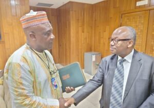 Sylvester Grigsby shaking hands with Abubakar Hashim, West Africa Bureau Chief of TheNEWS at the President’s office, Mansion, Monrovia.jpg