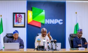 NNPCL Group Chief Executive Officer Mallam Mele Kyari, right, Chief Akinyelure, left and Lawal Musa.jpg