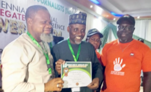 National Chairman of the Nigeria Union of Journalists, Comrade Alhassan Yahaya, centre.jpg