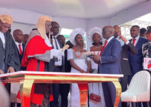 Senator Monday Okphebholo being sworn in by the Edo Chief Judge.jpg