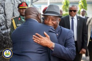 Presidents Bio and Boakai in warm embrace.jpg