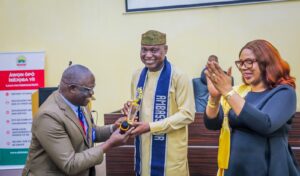 Vice Chancellor of the University, Professor Kayode Adebowale presenting the award to Governor Oyebanji.jpg