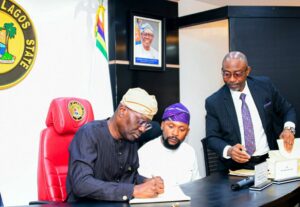 Governor of Lagos State, Mr. Babajide Sanwo-Olu signing the Lagos Electricity bill 2024 into law, with him are Chairman, House Committee on Energy & Mineral Resources, Hon. Sabur Oluwa and the Attorney General/Commissioner for Justice, Mr. Lawal Pedro (SAN), at the conference room of Lagos House, Alausa, Ikeja, on Tuesday, 03 December 2024