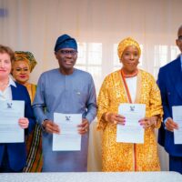 Governor Babajide Sanwo-Olu, Commissioner for Commerce, Cooperatives, Trade and Investment, Mrs. Folashade Ambrose-Medebem, Mrs. Rosie Glazebrook and others after the MoU signing ceremony.jpg