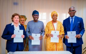 Governor Babajide Sanwo-Olu, Commissioner for Commerce, Cooperatives, Trade and Investment, Mrs. Folashade Ambrose-Medebem, Mrs. Rosie Glazebrook and others after the MoU signing ceremony.jpg
