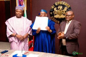 Governor Namadi assented his signature on the law at the Council Chambers, Government House.jpg