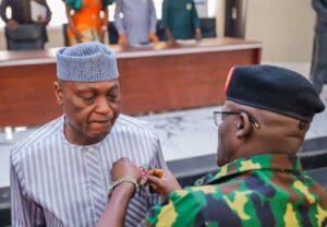 Governor Oyebanji being decorated with the Armed Forces emblem