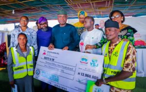 Governor Oyebanji presenting the cheque.jpg